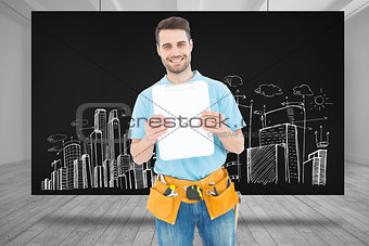 Composite image of construction worker showing blank paper on clipboard