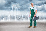 Composite image of repairman holding toolbox
