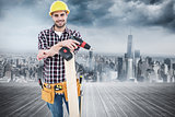 Composite image of confident male carpenter with drill machine and plank