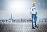 Composite image of manual worker with hammer and toolbox