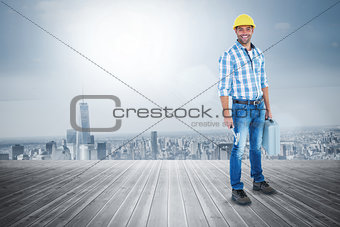 Composite image of manual worker with hammer and toolbox