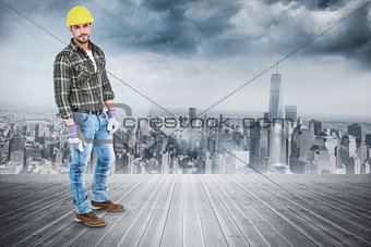 Composite image of full length portrait of confident handyman