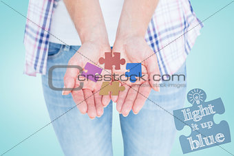 Composite image of hipster showing her hands