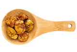 dried goldenberries on wooden spoon
