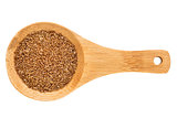 teff grain on wooden spoon