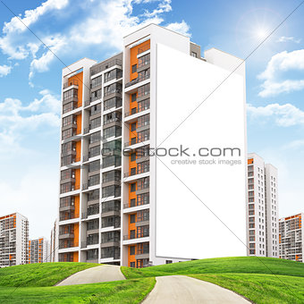 Set of buildings under blue sky with road