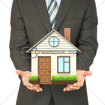 Man in suit holding house