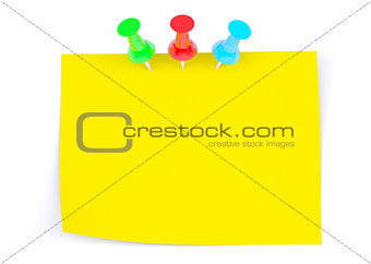Yellow sticker with three drawing pins