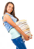 young student girl holding a stack of books