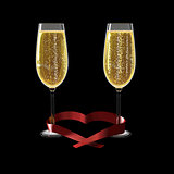 Two glasses of good champagne and a ribbon heart shaped