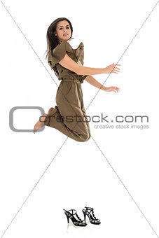Young business woman jumping high