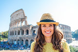 Portrait of smiling woman at Colosseum in Rome in summer