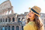 Portrait of laughing woman at Colosseum in Rome in summer