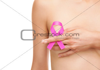 Woman with a breast cancer awareness ribbon
