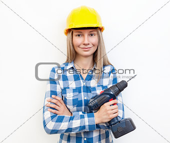 Woman doing the DIY work and wearing protective helmet
