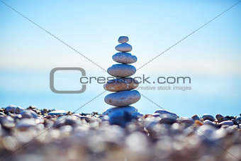Stones balance on beach, sunrise shot