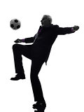 senior business man playing soccer silhouette