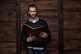 young handsome man with a book
