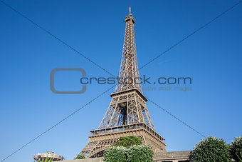 The Eiffel Tower over blue sky in Paris, France
