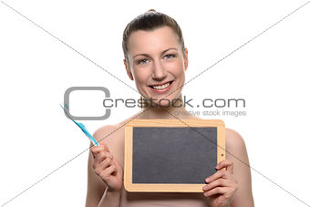 Bare woman holding toothbrush and empty board