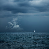 Boat Sailing in Center of Storm Formation