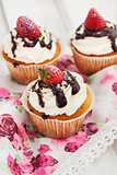 Delicious cream and strawberry cupcakes