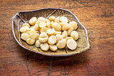 macadamia nuts on leaf bowl