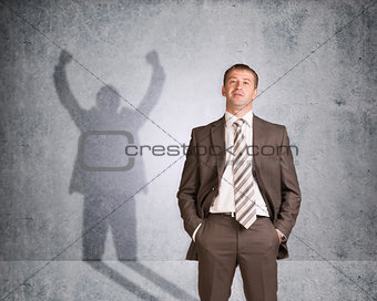 Businessman with shadow showing win
