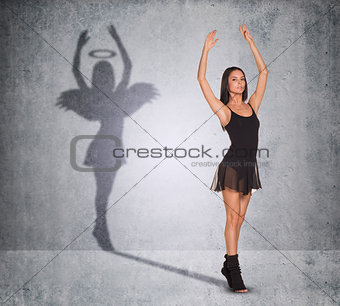 Ballet dancer with shadow showing angel side 