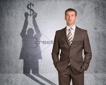 Businessman with shadow holding dollar sign