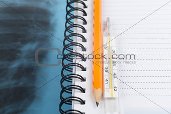 X-ray examination and copy book with pencil