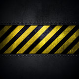 Abstract metallic background with yellow and black warning strip