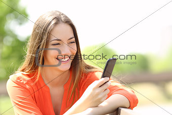 Girl using a smart phone in summer