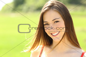 Woman with perfect teeth and smile looking you