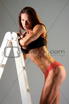 Female athlete resting on stairs