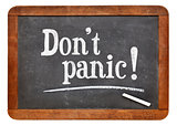 Do not panic - text on blackboard