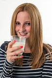 young woman drinking a glass of milk