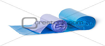 Blue and violet rolls of plastic garbage bags