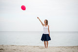 Happy girl holding air balloon