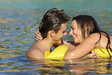 Couple kissing in summer vacation on the beach