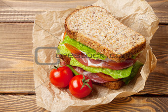 Sandwich with salad, ham, cheese and tomatoes