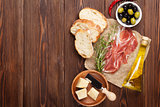 Bruschetta ingredients - prosciutto, olives, cheese