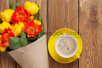 Colorful tulips bouquet and coffee cup