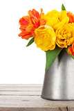 Colorful tulips bouquet in watering can