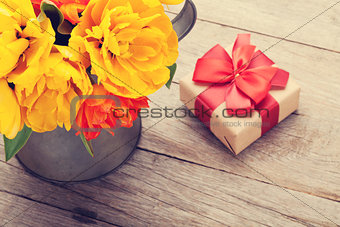 Colorful tulips bouquet and gift box