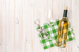 White wine bottle, glass and corkscrew