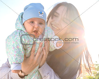 Mother and baby with backlight