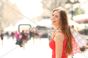 Shopper woman shopping in the street in summer