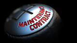 Maintenance Contract on Gear Shift with Red Text.