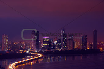 Panama City Night Skyline With Car Traffic On Highway